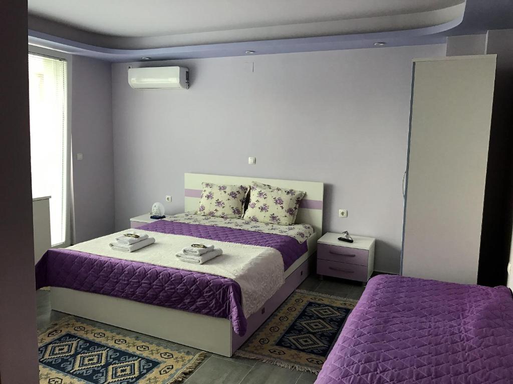 Villa Metulevi spacious purple bedroom wide angle